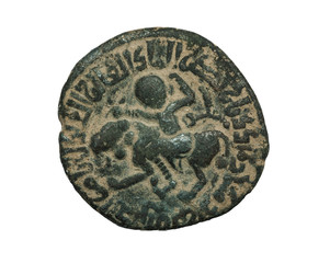 Ancient bronze islamic coin with image of person riding the lion isolated on white