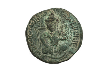 Ancient bronze islamic coin with seated figure isolated on white