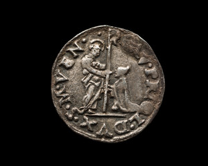 Ancient silver Venetian coin isolated on black