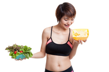 Beautiful Asian healthy girl salad and potato chips.