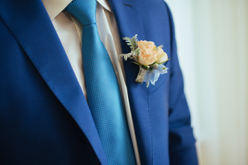 the groom in a blue suit with tie © Dmitriy Shipilov