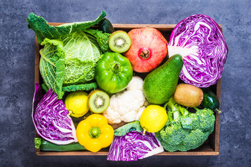 Vegetables and fruits in wood box, winter variety healthy food.