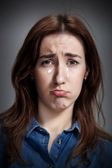 The portrait of a beautiful sad girl closeup