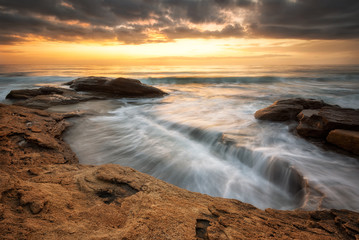 Fototapeta premium Rocky sunrise / A beautiful view with first rays at a rocky Black Sea coast, Bulgaria