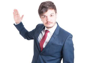 Business man standing looking violent with hand up