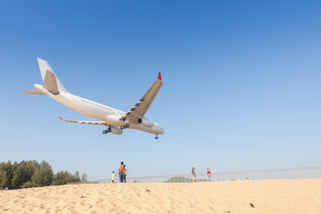Fototapeta na wymiar Airplane is landing at Phuket airport.
