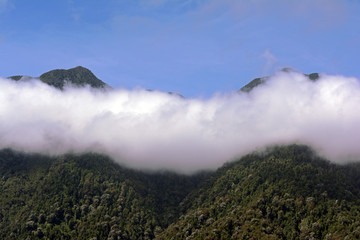 high mountains of the range with clouds in between