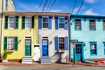 Fototapeta na wymiar Old Colourful Wooden Terraced Houses and Blue Sky