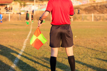 Football assistant referee in action