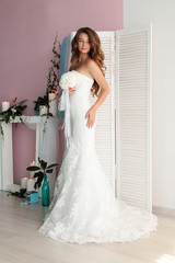 Fototapeta premium beautiful girl with dark hair, making preparation in her wedding
