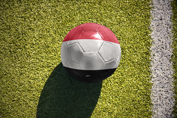 football ball with the national flag of yemen lies on the field