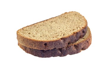 Slice of fresh rye bread isolated on white background