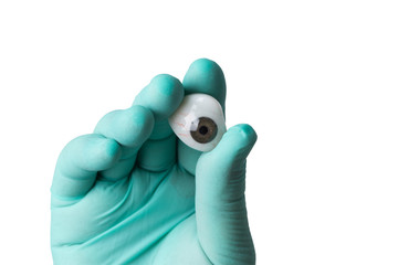 ocular prosthesis in the hands of the medic