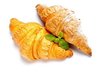 two fresh croissants on white background