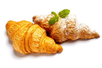 two fresh croissants on white background