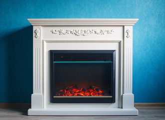 Fototapety  Black electric fireplace with decoration photographed in the interior
