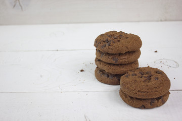 Chocolate biscuits on white wood