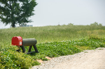 red mailbox beside the country road