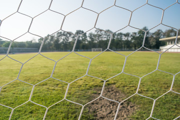 close up soccer goal net with sunshine in the morning