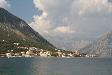 Fototapeta na wymiar Nice view of the ancient town of Prcanj on the shore of Kotor Bay. 