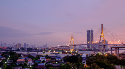 Elevated expressway / View of elevated expressway cross the river and city at twilight.