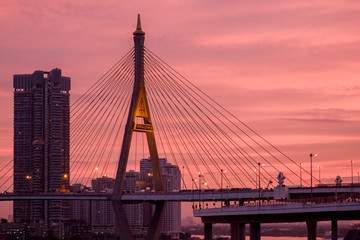 Elevated expressway / Silhouette of elevated expressway cross the river at twilight.