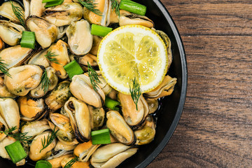 Mussels in a simple rustic table.