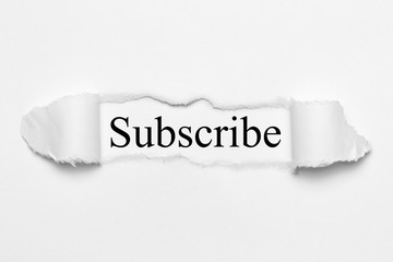 Subscribe on white torn paper