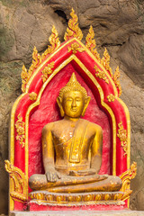 Fototapeta premium Buddha in the cave , deep to the cave in Thailand