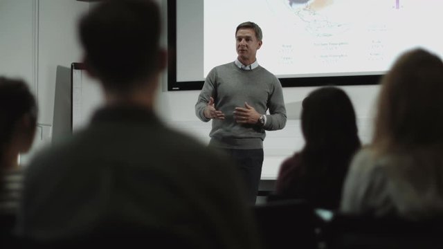 Professor teaching with projector