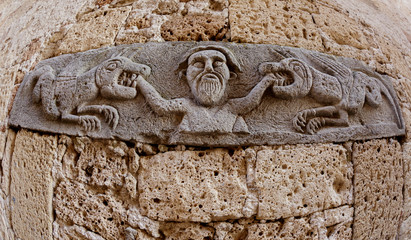 The bas-relief and high relief over the torture chamber, the Middle Ages, Pitigliano, Tuscany, Italy. - obrazy, fototapety, plakaty