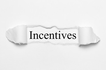 Incentives on white torn paper