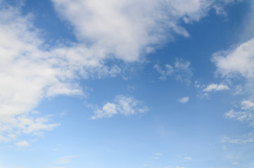 Naklejka na ściany i meble White fluffy clouds in blue sky and space