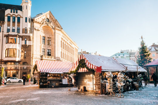 Christmas Market On Dome Square In Riga, Latvia. Trading Houses 