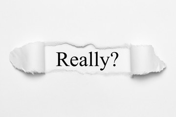 Really? on white torn paper