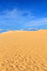 Sand dune with footprints