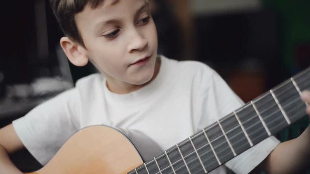 boy play guitar