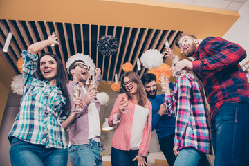Obraz premium Party time. Six attractive happy laughing friends, boys and girl
