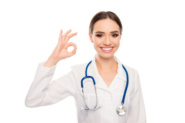 Fototapeta premium Portrait of happy doctor with beaming smile showing ok gesture