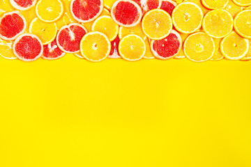 Tasty colorful bright fruity background with oranges and grapefruits. Top view. Healthy life or detox concept. Healthy food.