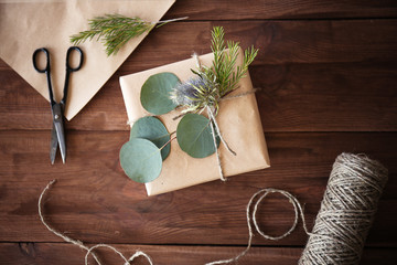 Handcrafted gift box with flowers on wooden table