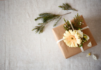 Handcrafted gift box with flowers on table