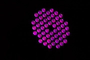 Circle background of pink color lights with spotlights texture and point