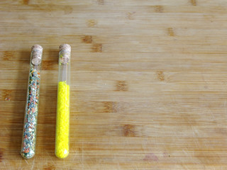 Spices in glass tubes on left Side