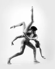 Gordijnen Young ballet dancers on a white background © Acronym