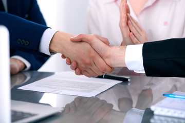 Business people shaking hands finishing up a meeting