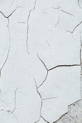 Close Up texture crack of Chipped White peeling paint, covered w