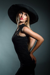 romantic girl in a hat with a wide brim