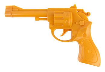 Isolated orange plastic toy gun.