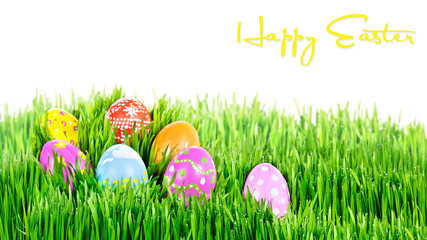 Hand painted Easter eggs nestling in grass